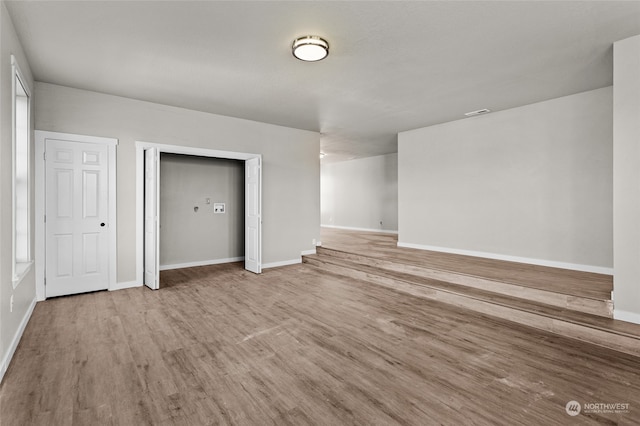 unfurnished bedroom featuring hardwood / wood-style floors