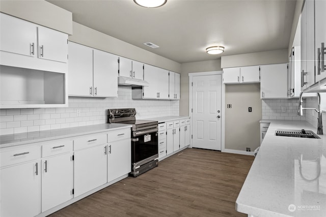 kitchen featuring sink, backsplash, white cabinetry, and stainless steel range with electric cooktop