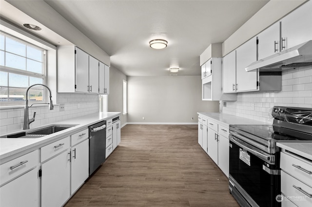 kitchen with black electric range oven, backsplash, sink, stainless steel dishwasher, and white cabinets