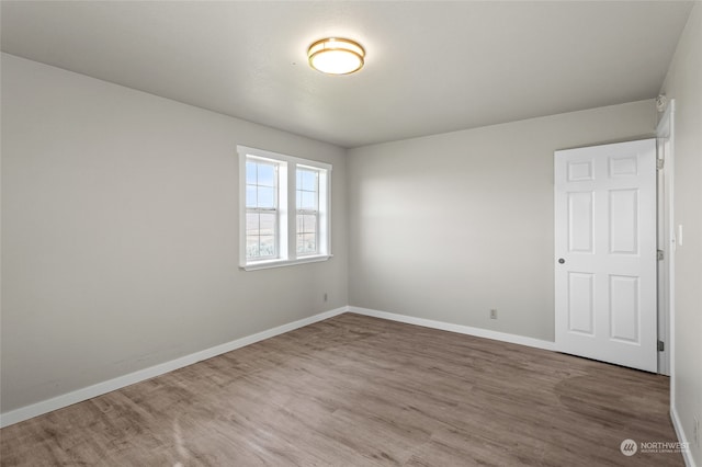 spare room featuring hardwood / wood-style flooring