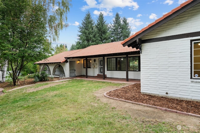 exterior space featuring a front lawn