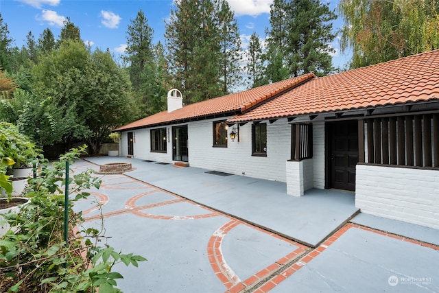 rear view of property with a patio