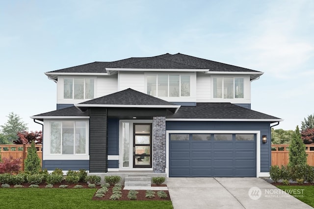 view of front of house featuring a garage and a front lawn