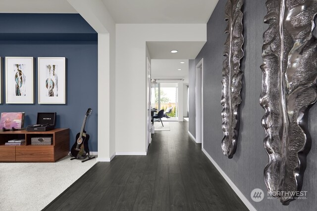 hall with dark hardwood / wood-style flooring