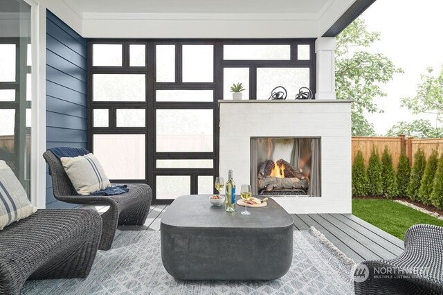 exterior space featuring an outdoor fireplace