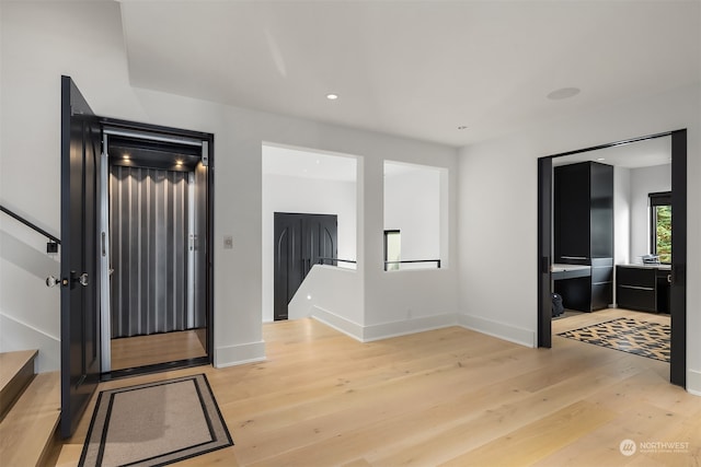 entryway with light wood-type flooring