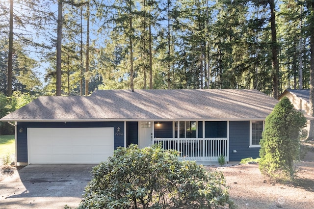 single story home with a garage and a porch