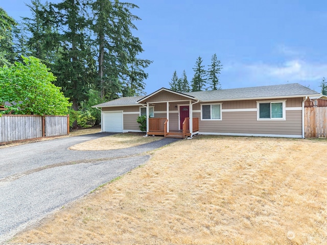 ranch-style home featuring a garage