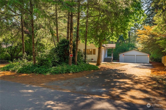 view of front of house featuring an outbuilding and a detached garage