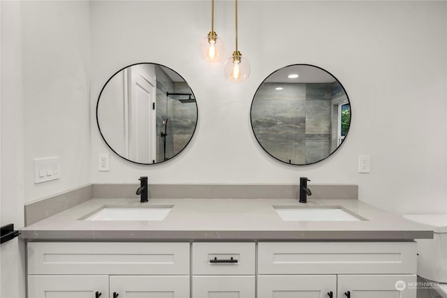 full bathroom featuring a sink and double vanity