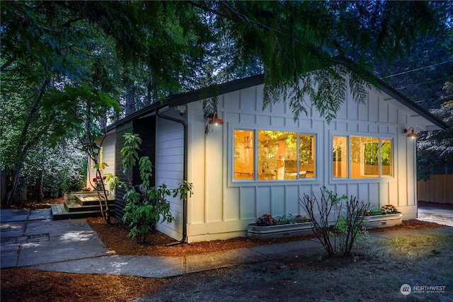 exterior space with fence and board and batten siding