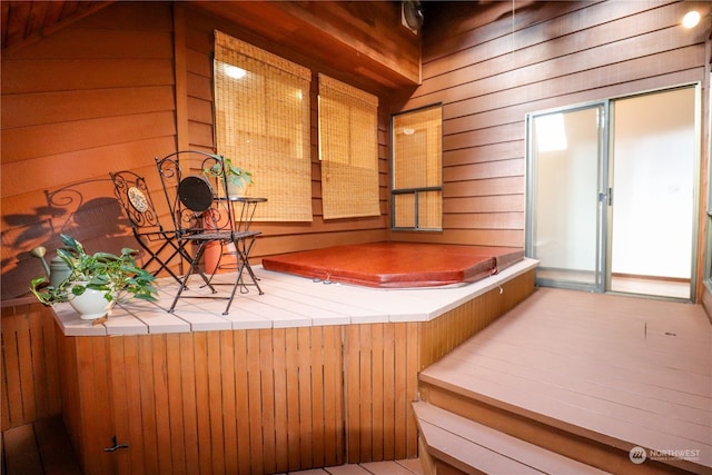 interior space featuring wood walls