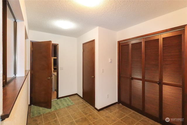 interior space featuring a textured ceiling