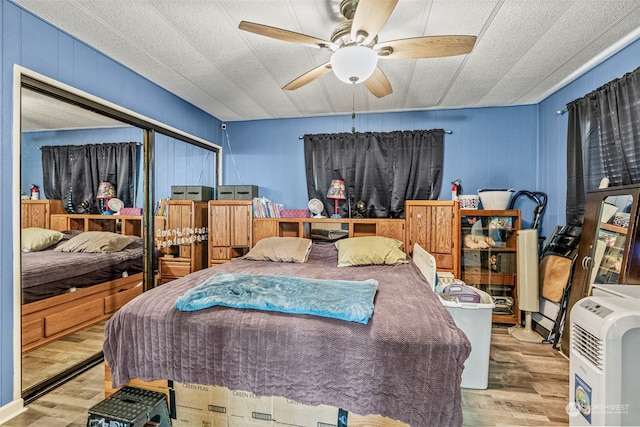 bedroom featuring ceiling fan and wood finished floors