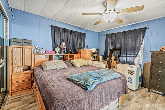 bedroom featuring a ceiling fan and wood finished floors