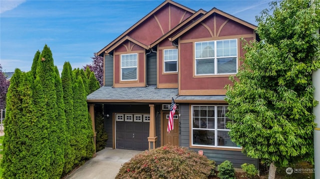 view of front of home featuring stucco siding, concrete driveway, and a garage