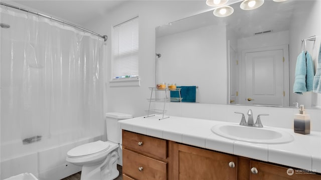 full bathroom with toilet, shower / tub combo with curtain, and vanity