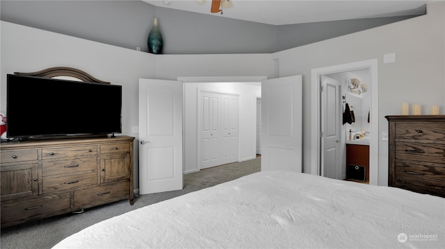 bedroom with lofted ceiling, carpet, a closet, and ensuite bathroom