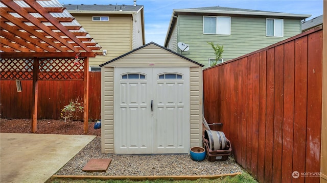 view of outbuilding featuring a pergola