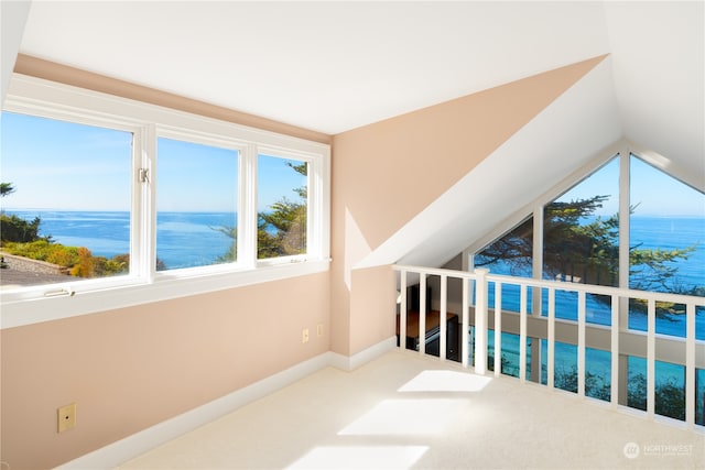 bonus room featuring vaulted ceiling, a water view, and carpet floors