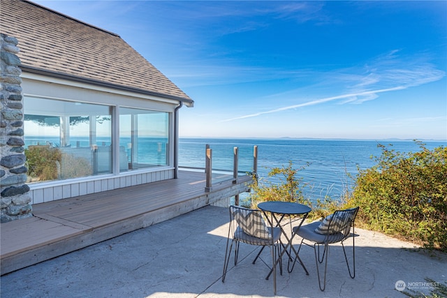 view of patio with a water view