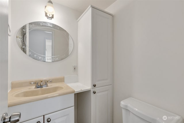 bathroom with vanity and toilet