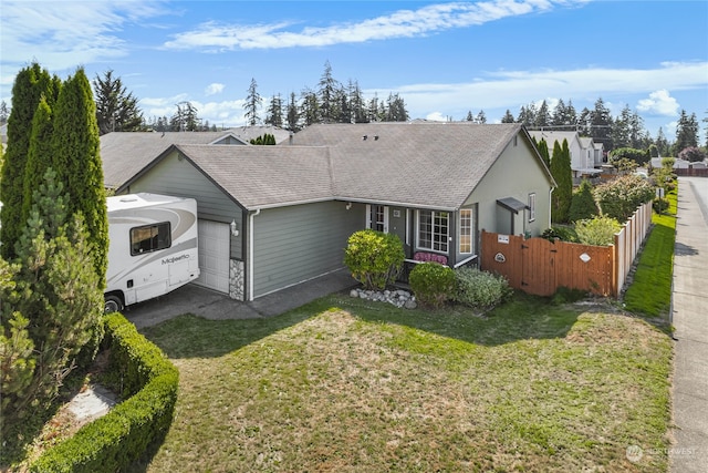 single story home featuring a front yard and a garage