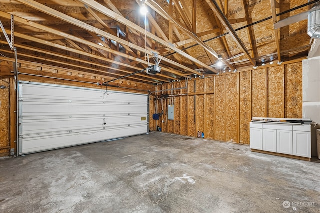 garage with electric panel and a garage door opener