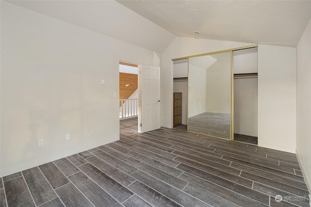 241 Warbass Way Unit A303, Friday Harbor, WA 98250 - unfurnished bedroom with wood tiled floors, lofted ceiling, and a closet