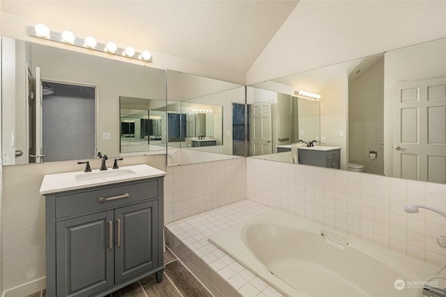 241 Warbass Way Unit A303, Friday Harbor, WA 98250 - full bath featuring vaulted ceiling, a bath, and two vanities