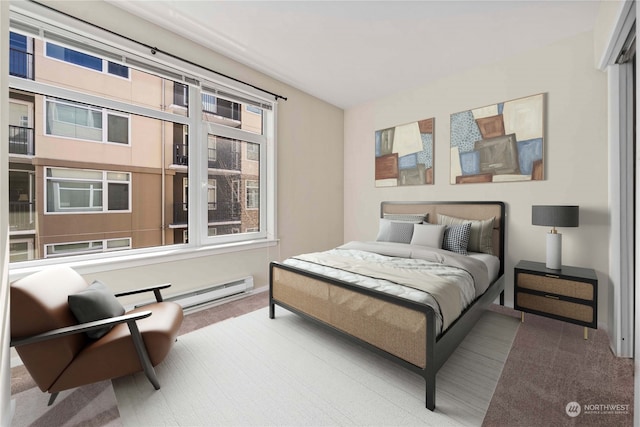 bedroom featuring a baseboard radiator and light carpet