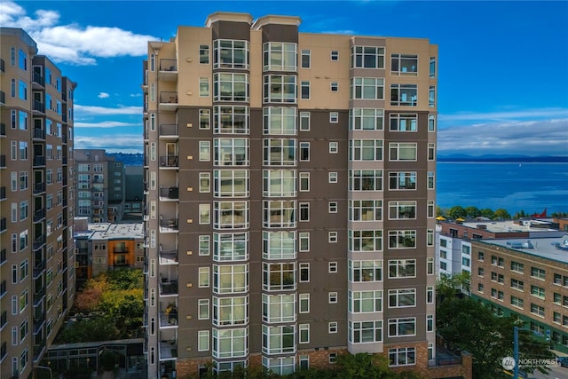 view of building exterior with a water view