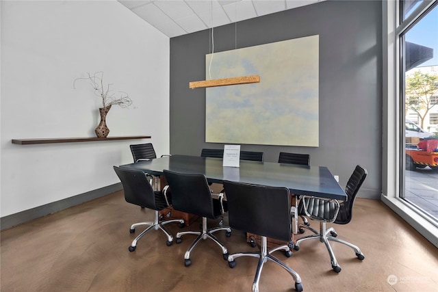 home office with concrete flooring