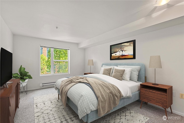 bedroom with light colored carpet and a baseboard radiator