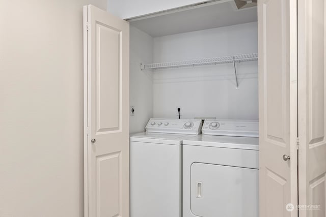 washroom with washer and clothes dryer