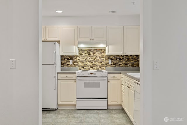 kitchen featuring white appliances, light tile patterned flooring, and tasteful backsplash