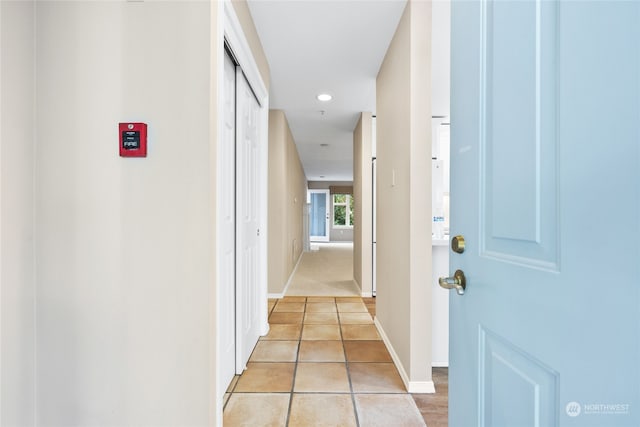 hallway featuring light tile patterned floors