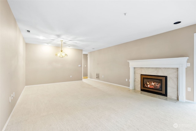 unfurnished living room featuring light carpet