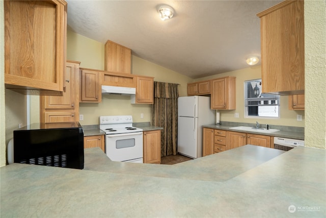 kitchen featuring lofted ceiling, light brown cabinetry, sink, and white appliances