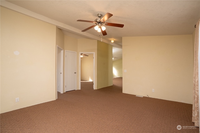 unfurnished bedroom featuring ceiling fan and carpet