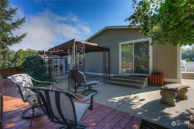 deck with a patio area and a pergola