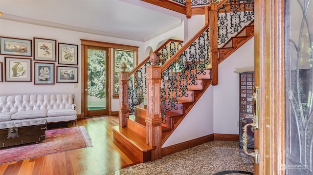 interior space featuring crown molding and hardwood / wood-style floors