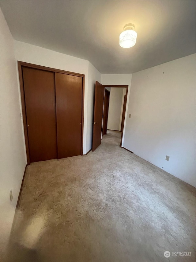 unfurnished bedroom featuring a closet