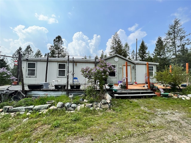 view of front of property with a wooden deck