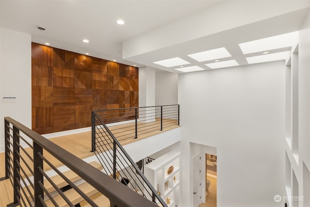 interior space featuring a skylight and hardwood / wood-style floors