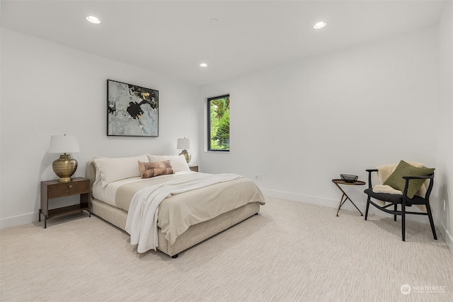 bedroom with light carpet