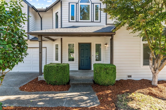 view of front of house featuring covered porch and a garage