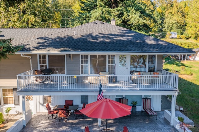 rear view of house featuring a patio area