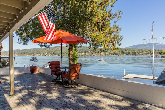 dock area featuring a water and mountain view