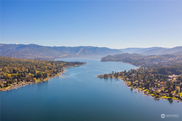 birds eye view of property featuring a water and mountain view